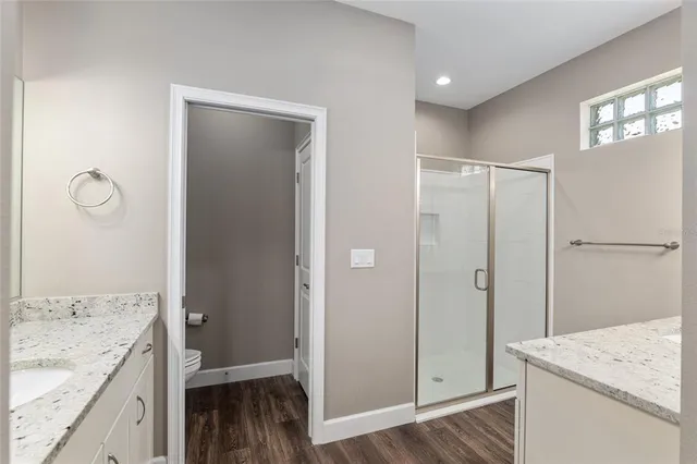 a bathroom with a sink a vanity and a mirror