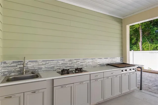 a view of a house with a backyard