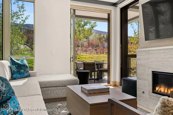 a living room with furniture fireplace and a flat screen tv
