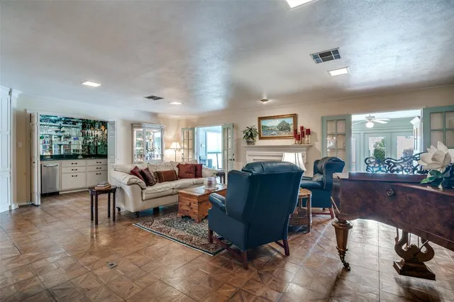 a living room with furniture rug and window