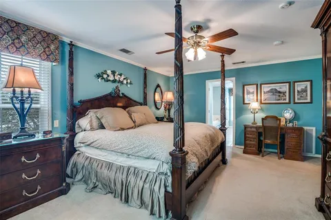 a bed room with a bed and a dresser