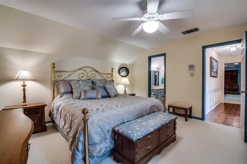 a bed room with a bed and a chandelier