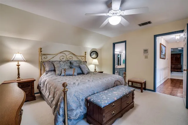 a bed room with a bed and a chandelier