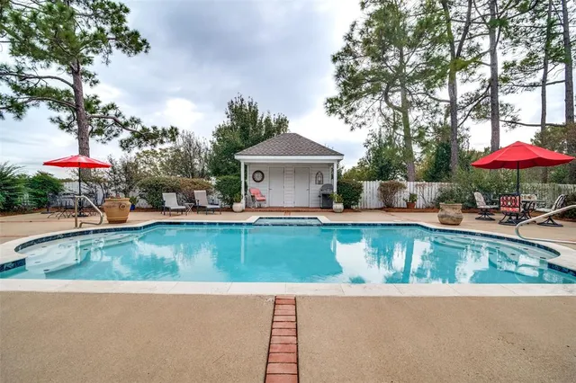 an outdoor view with a pool table and chairs