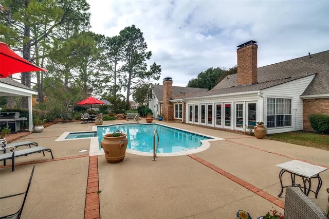 a view of a patio with a table and chairs