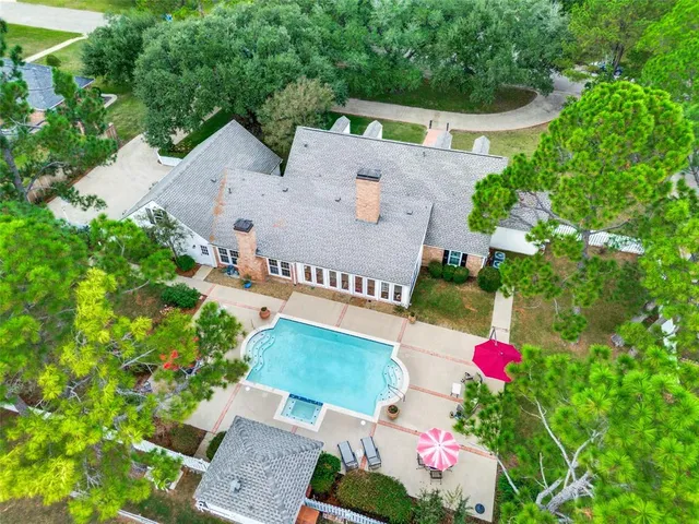 an aerial view of house with yard