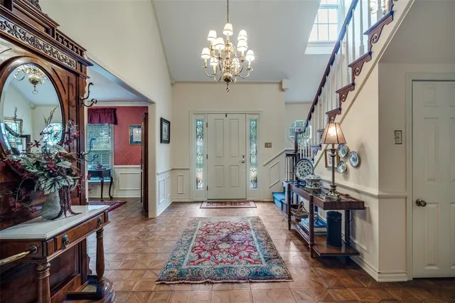 a view of a livingroom with furniture and staircase