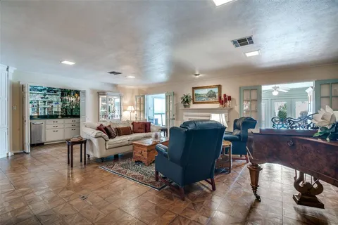 a living room with furniture rug and window