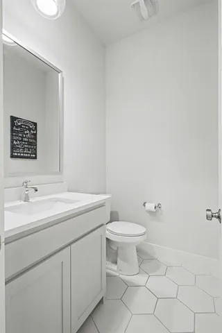 a spacious bedroom with a bed a couch and a window