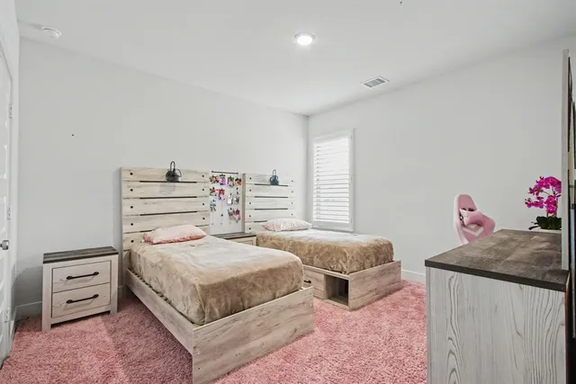 a bedroom with furniture and a window