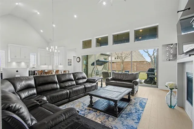a living room with furniture a dining table and chairs