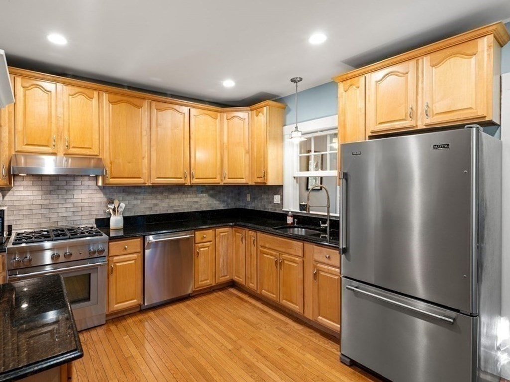 16 Manson Road Needham, MA 02494 - Photo 12 of 34 a kitchen with granite countertop stainless steel appliances a refrigerator sink and cabinets