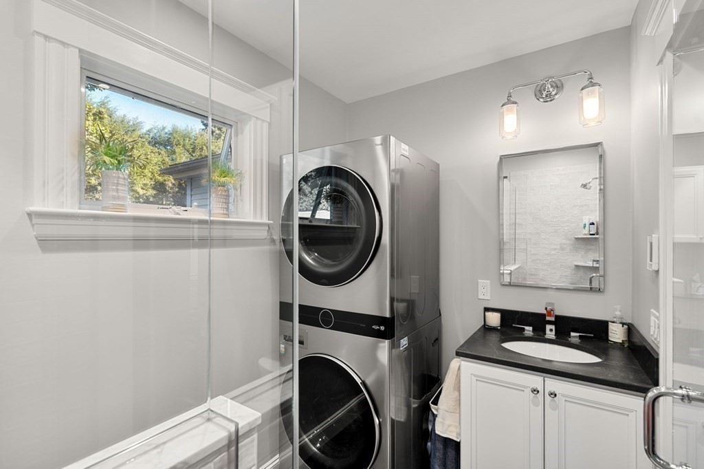 16 Manson Road Needham, MA 02494 - Photo 19 of 34 a bathroom with a sink a washer and dryer