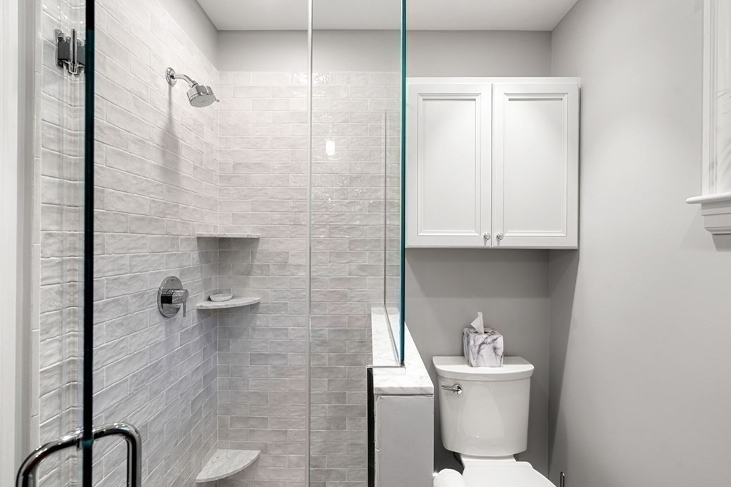 16 Manson Road Needham, MA 02494 - Photo 20 of 34 a bathroom with a sink a toilet and shower