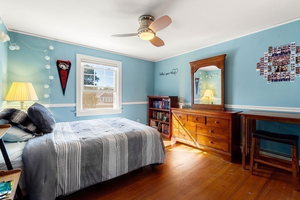 16 Manson Road Needham, MA 02494 - Photo 23 of 34 a bedroom with a bed and a dresser