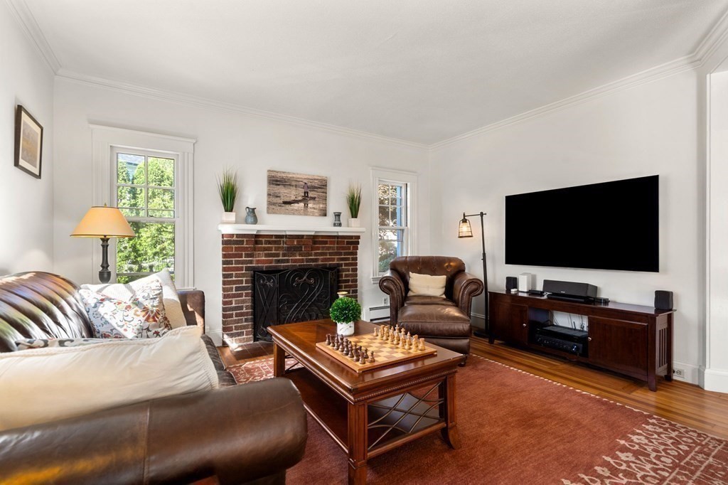 16 Manson Road Needham, MA 02494 - Photo 7 of 34 a living room with furniture and a flat screen tv