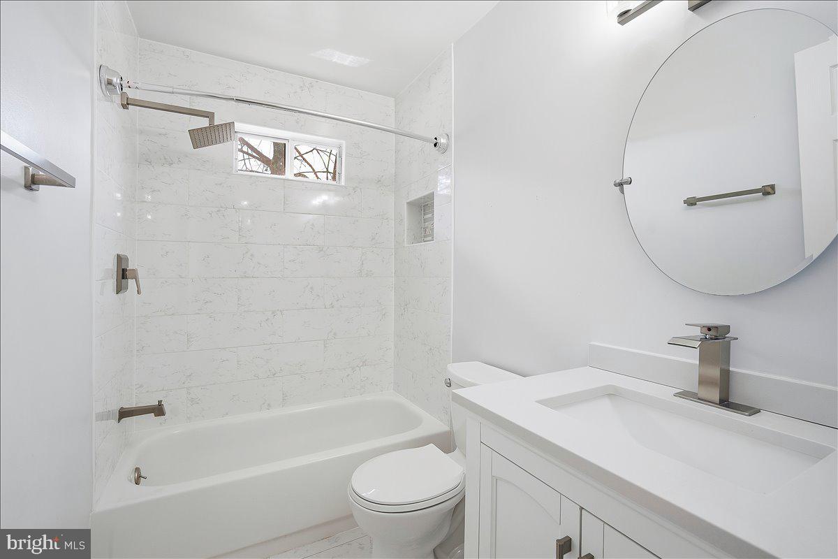 3912 Gelding Lane Olney, MD 20832 - Photo 18 of 62 a bathroom with a granite countertop sink a toilet and shower