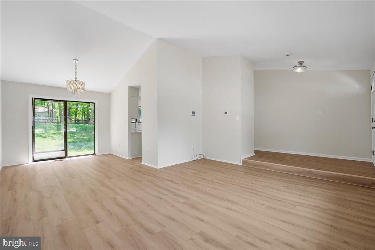 3912 Gelding Lane Olney, MD 20832 - Photo 58 of 62 a view of an empty room with wooden floor and a window