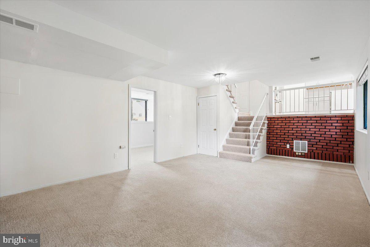 3912 Gelding Lane Olney, MD 20832 - Photo 22 of 62 a view of an empty room with a fireplace