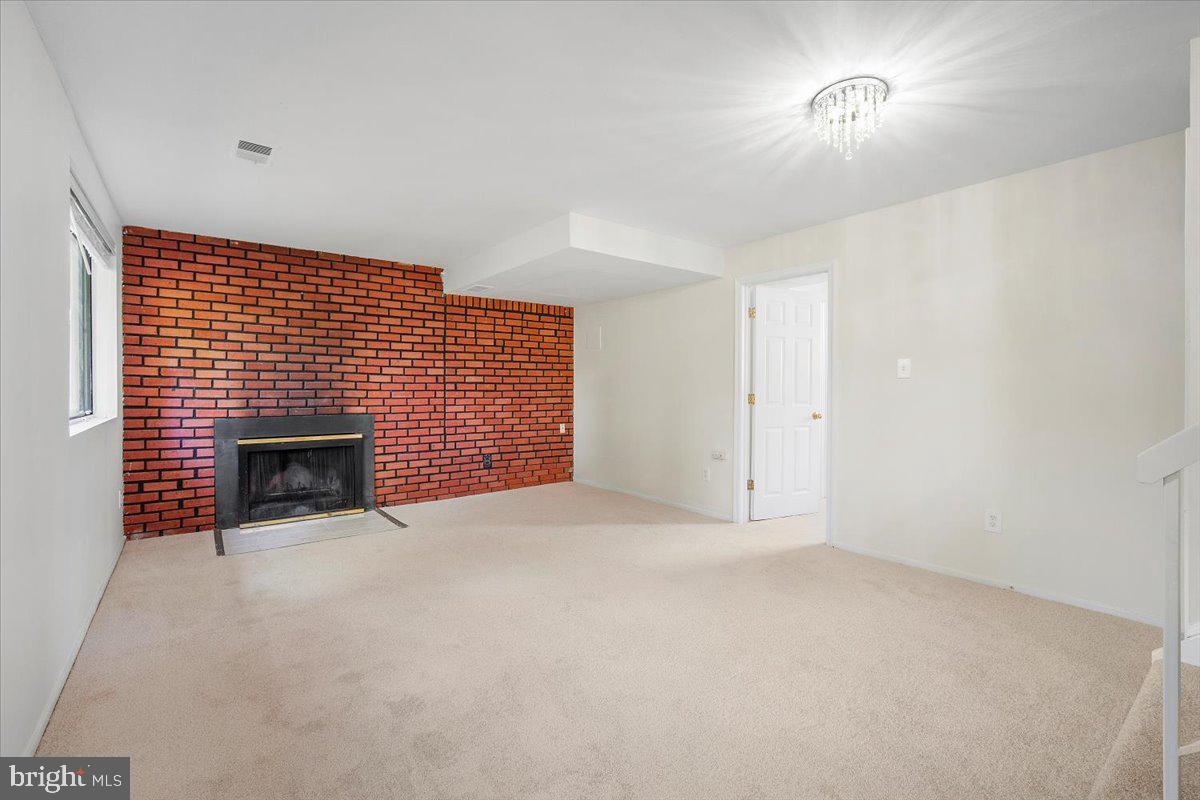 3912 Gelding Lane Olney, MD 20832 - Photo 23 of 62 a view of empty room with a fireplace