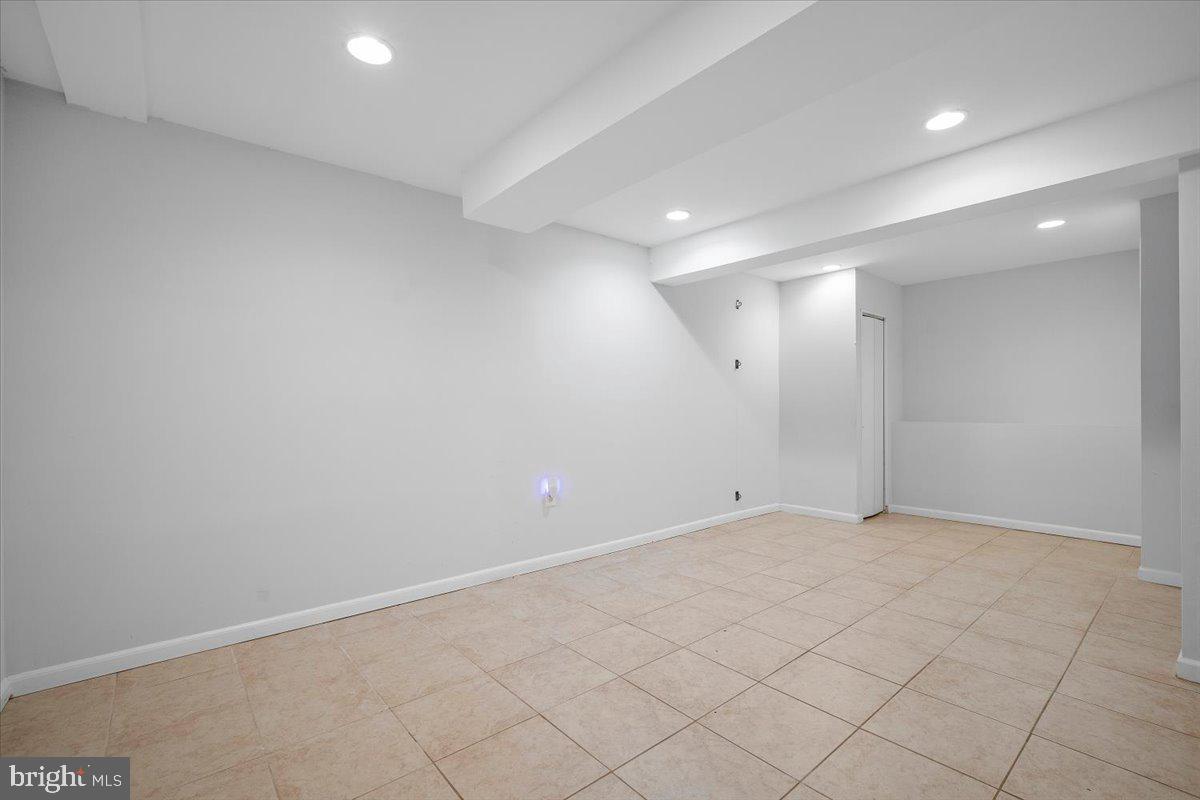 3912 Gelding Lane Olney, MD 20832 - Photo 32 of 62 an empty room with white walls and tiles