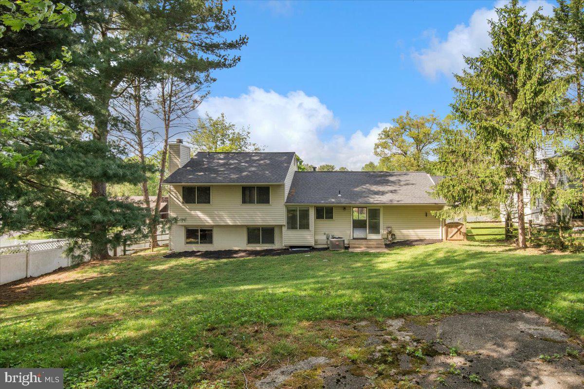 3912 Gelding Lane Olney, MD 20832 - Photo 35 of 62 a view of a house with a big yard potted plants and large tree