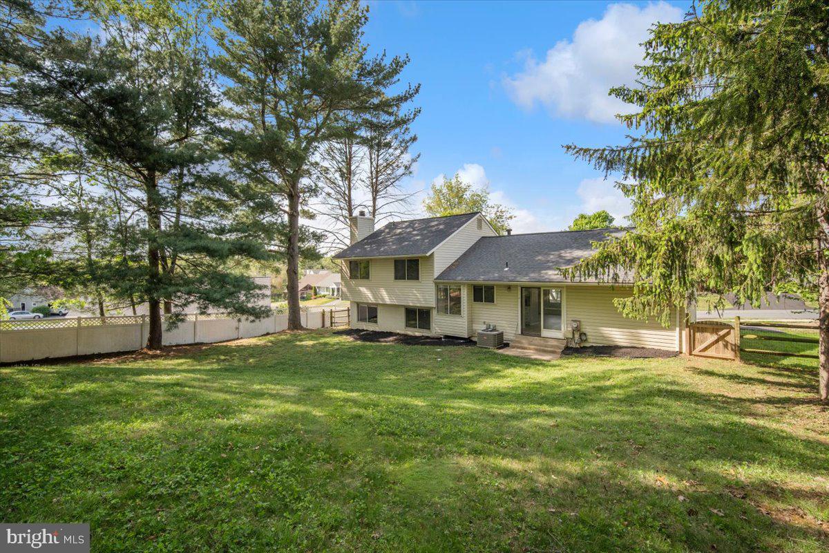 3912 Gelding Lane Olney, MD 20832 - Photo 36 of 62 a view of a house with a big yard and large trees