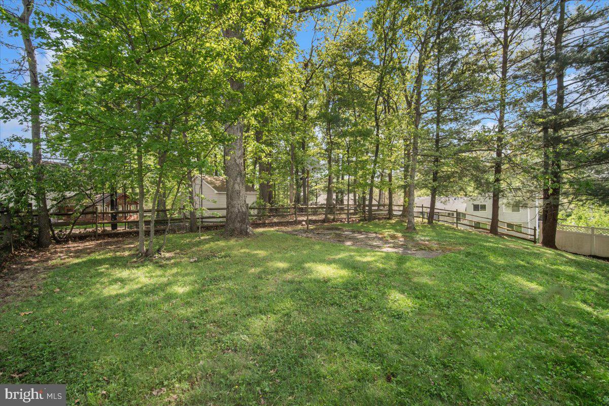 3912 Gelding Lane Olney, MD 20832 - Photo 37 of 62 a view of outdoor space with deck and garden