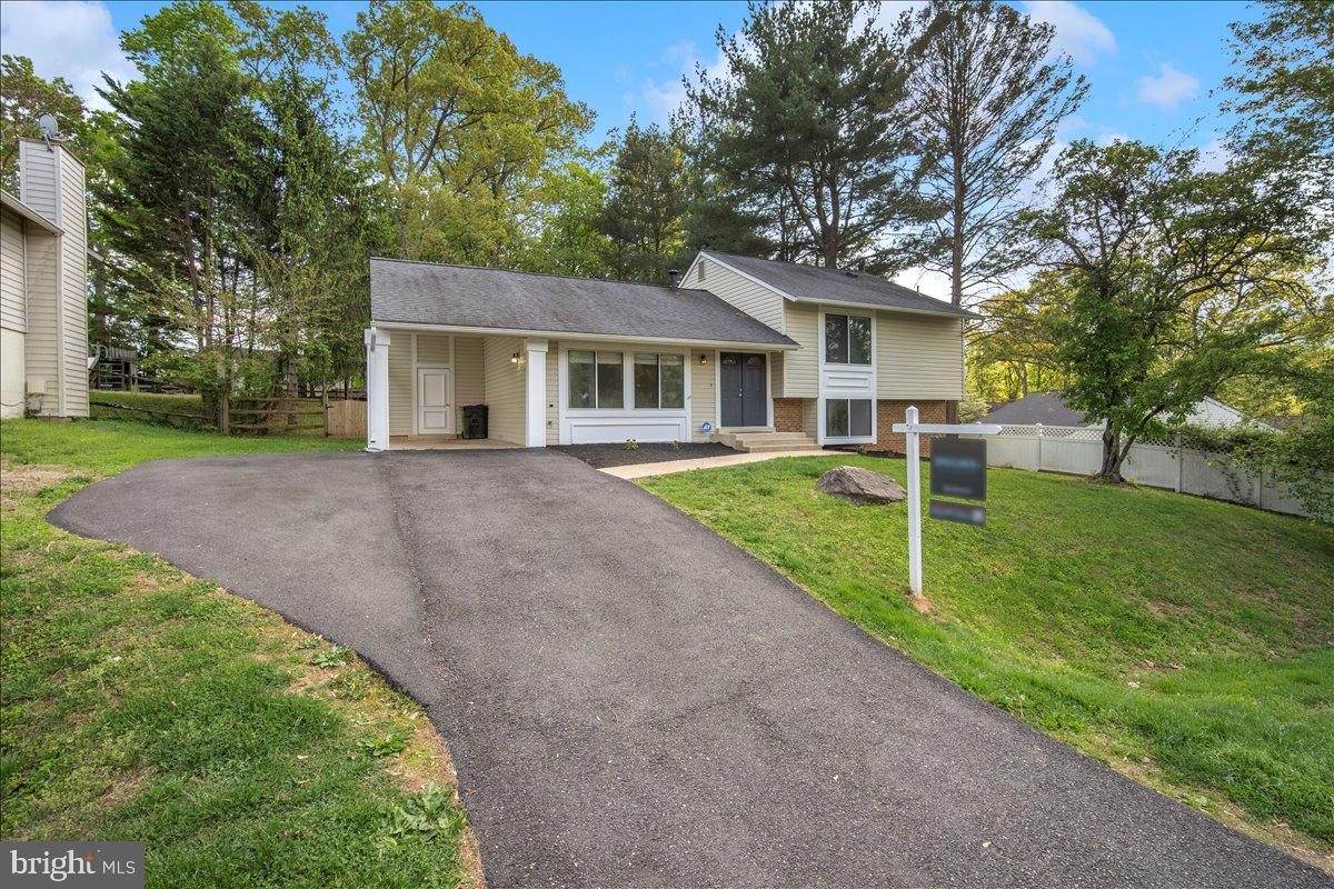 3912 Gelding Lane Olney, MD 20832 - Photo 38 of 62 a front view of house with yard and green space
