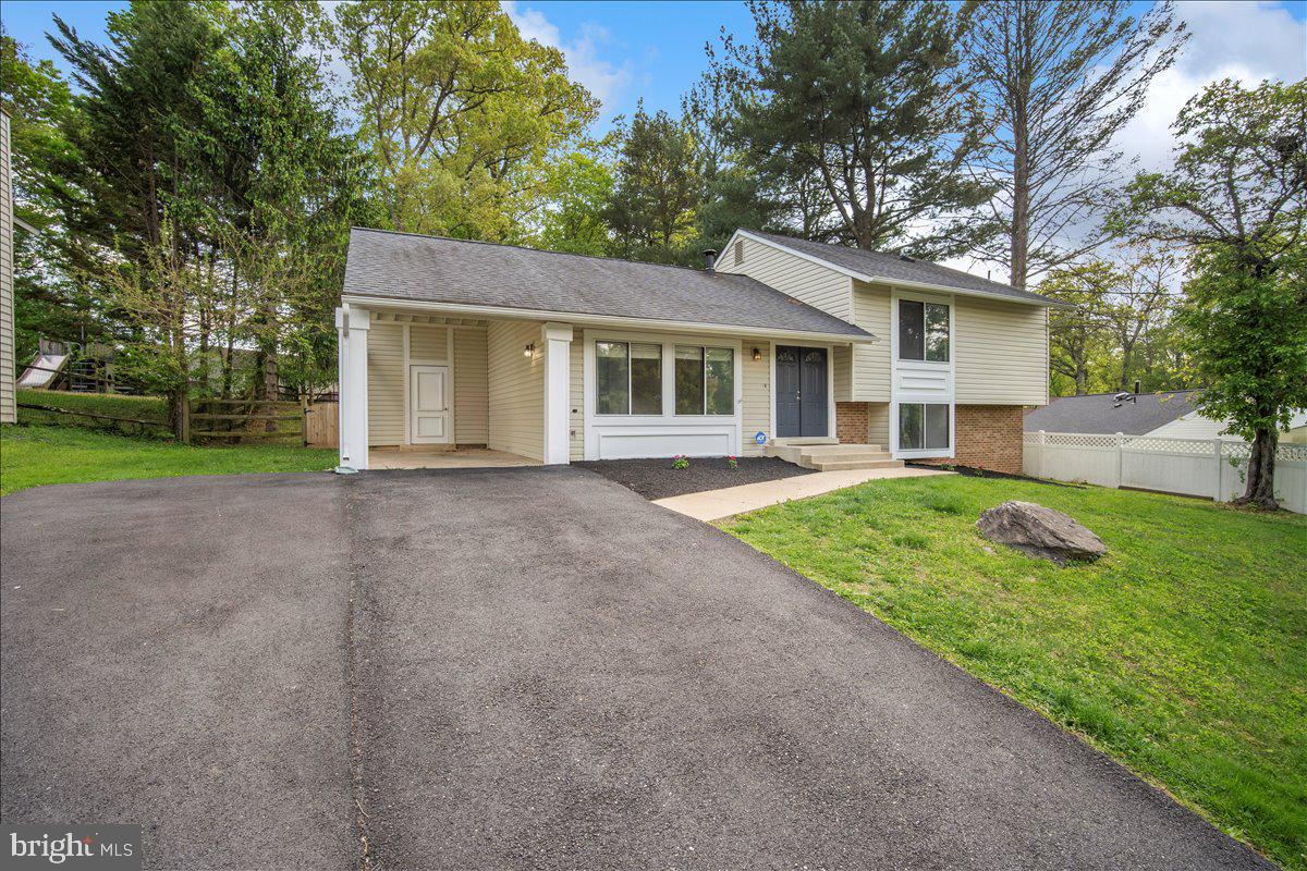 3912 Gelding Lane Olney, MD 20832 - Photo 39 of 62 a view of a house with a yard and large tree