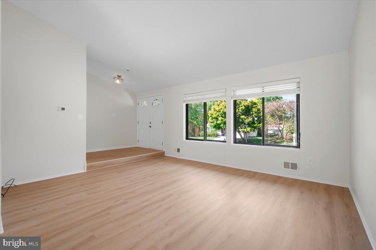 3912 Gelding Lane Olney, MD 20832 - Photo 3 of 62 an empty room with wooden floor and windows