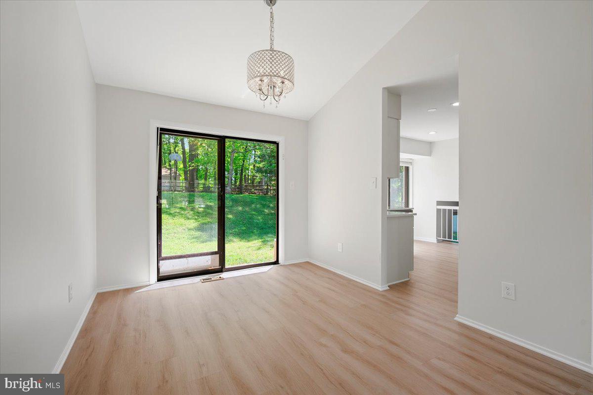 3912 Gelding Lane Olney, MD 20832 - Photo 4 of 62 a view of empty room with wooden floor and fan
