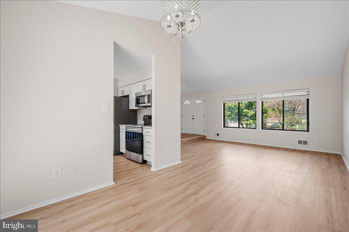 3912 Gelding Lane Olney, MD 20832 - Photo 5 of 62 wooden floor in an empty room with a window