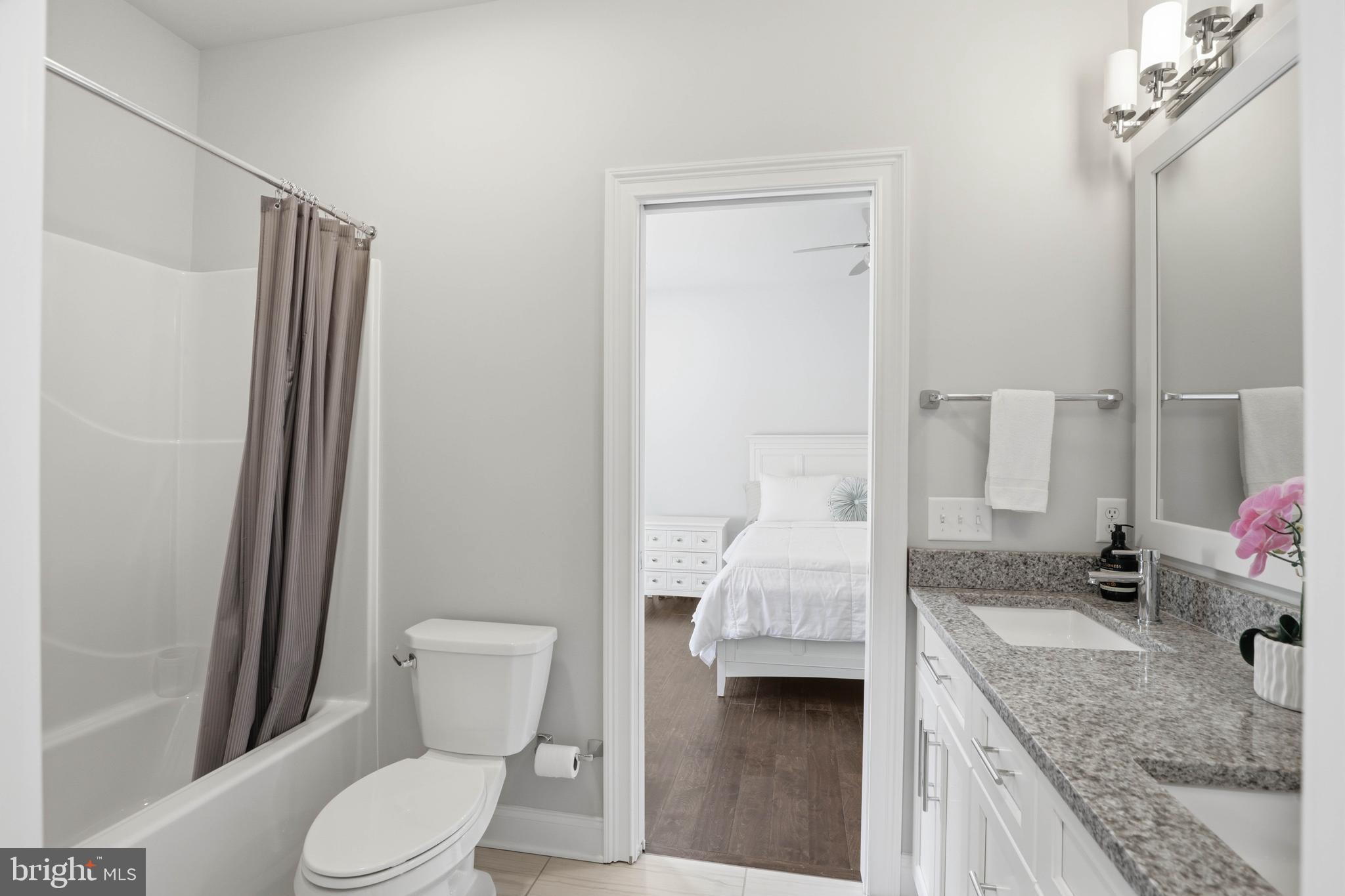 360 Addison Place Lancaster, PA 17601 - Photo 48 of 78 a bathroom with a granite countertop sink toilet and shower