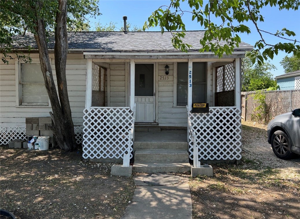 2513 Terrace Street Corpus Christi, TX 78404 - Photo 3 of 24 a view of a house with a large window and wooden fence