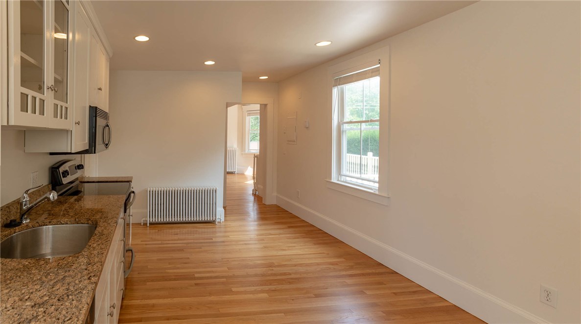 51 Annandale Road Newport, RI 02840 - Photo 12 of 22 Kitchen with Granite and Stainless Steel with view to the Living Room