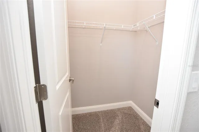 a bathroom with a granite countertop sink a mirror a toilet and bathtub