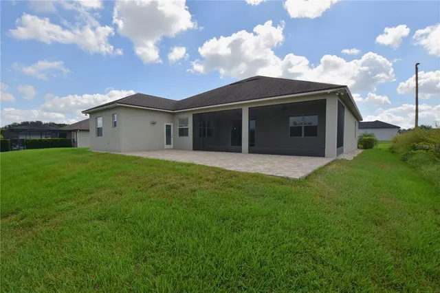 a view of a backyard with a garden and plants
