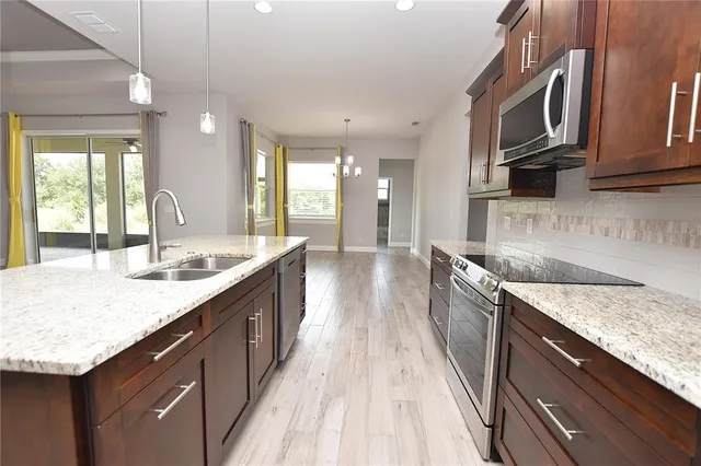 a large kitchen with granite countertop a lot of counter space