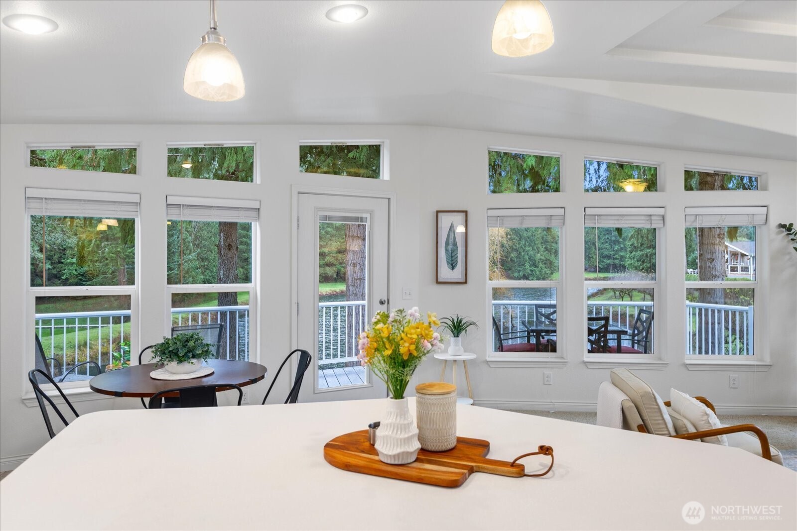 23825 15th Avenue Southeast, Unit 169 Bothell, WA 98021 - Photo 13 of 25 a dining room with furniture a large window and wooden floor