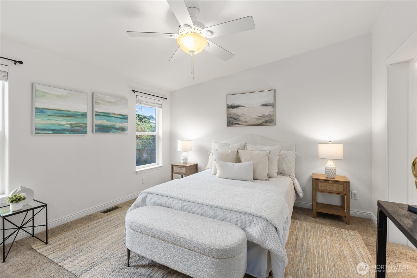 23825 15th Avenue Southeast, Unit 169 Bothell, WA 98021 - Photo 15 of 25 a bedroom with a bed and a chandelier