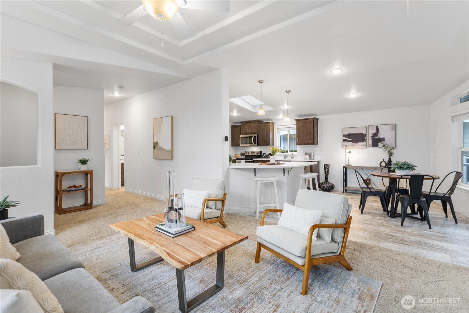 23825 15th Avenue Southeast, Unit 169 Bothell, WA 98021 - Photo 5 of 25 a living room with furniture kitchen view and a dining table