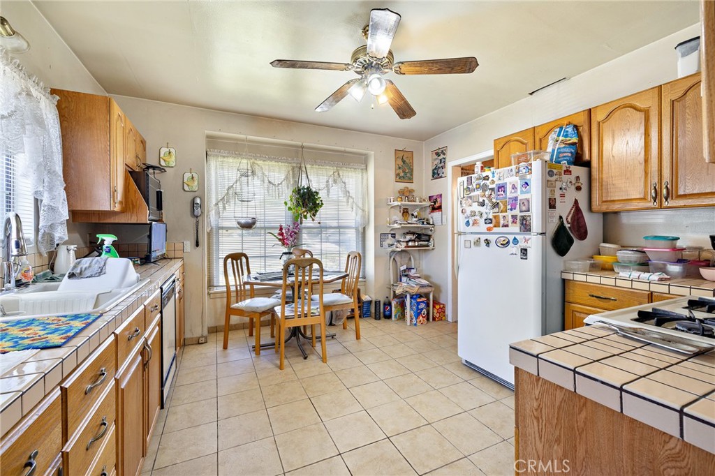 301 South Harris Avenue Compton, CA 90221 - Photo 13 of 30 a living room with stainless steel appliances kitchen island granite countertop furniture and a kitchen view