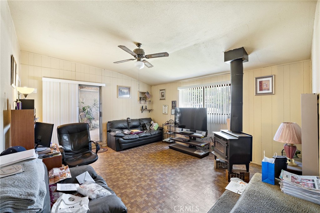 301 South Harris Avenue Compton, CA 90221 - Photo 14 of 30 a living room with furniture fireplace and a window