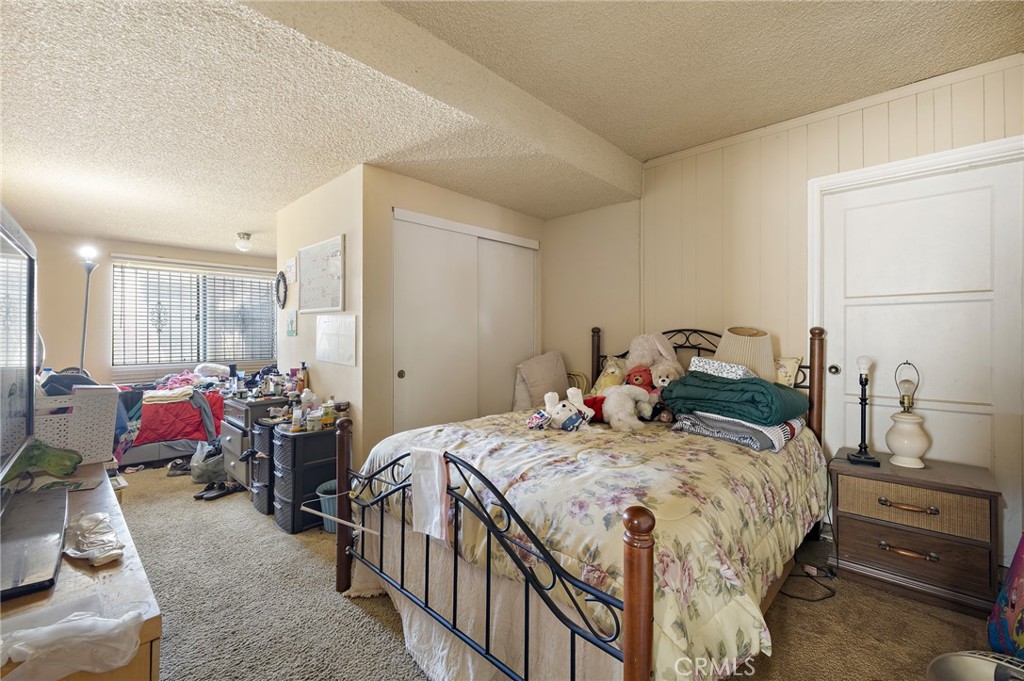 301 South Harris Avenue Compton, CA 90221 - Photo 18 of 30 a bed room with a bed and a chair