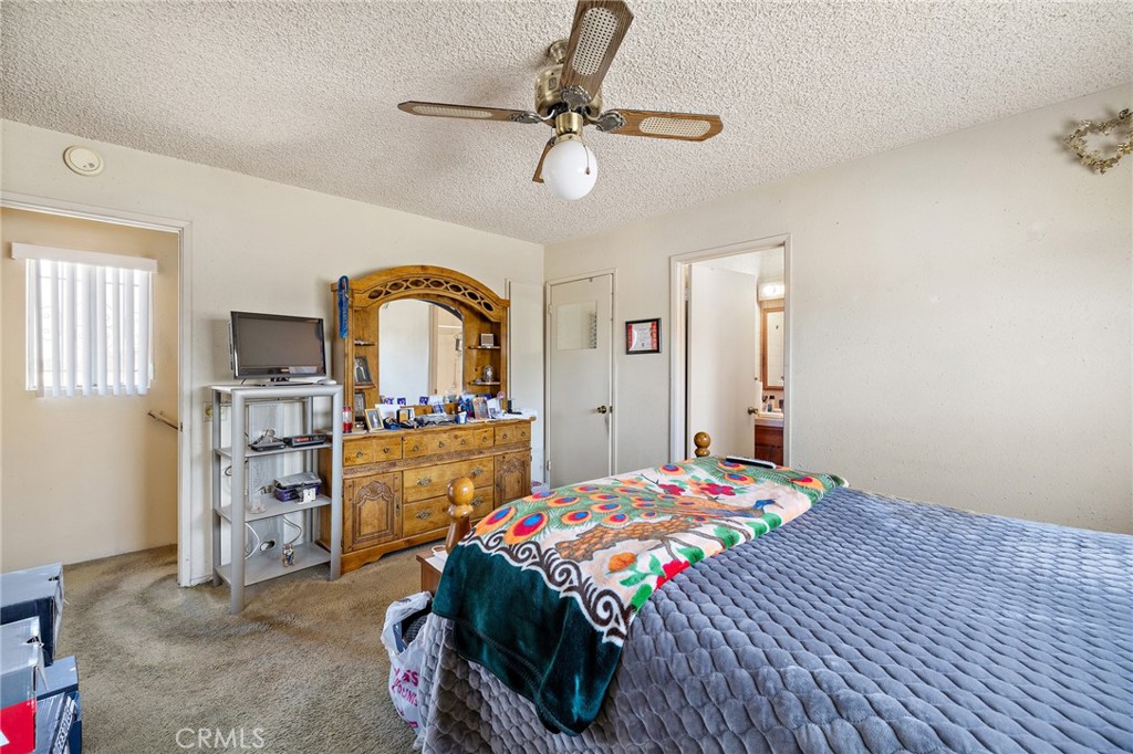 301 South Harris Avenue Compton, CA 90221 - Photo 20 of 30 a bedroom with a bed and a dresser