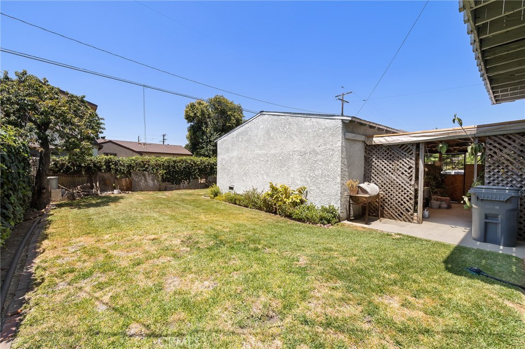 301 South Harris Avenue Compton, CA 90221 - Photo 26 of 30 a backyard of a house with yard and outdoor seating