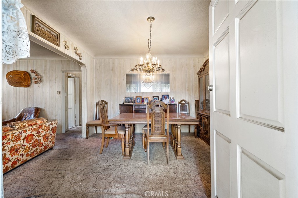 301 South Harris Avenue Compton, CA 90221 - Photo 7 of 30 a view of a dining room with furniture and chandelier