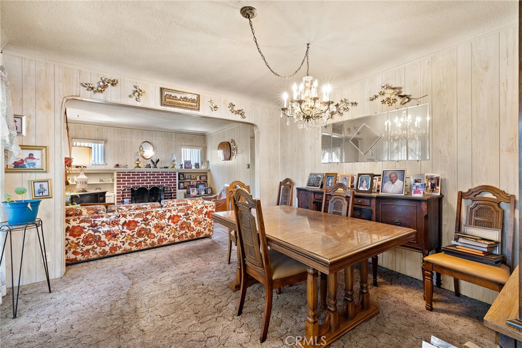 301 South Harris Avenue Compton, CA 90221 - Photo 8 of 30 a view of a dining room with furniture and a chandelier