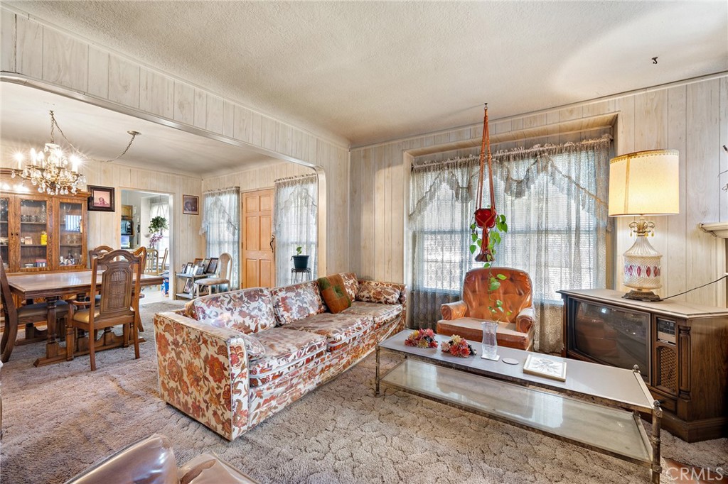301 South Harris Avenue Compton, CA 90221 - Photo 9 of 30 a living room with furniture kitchen view and large windows